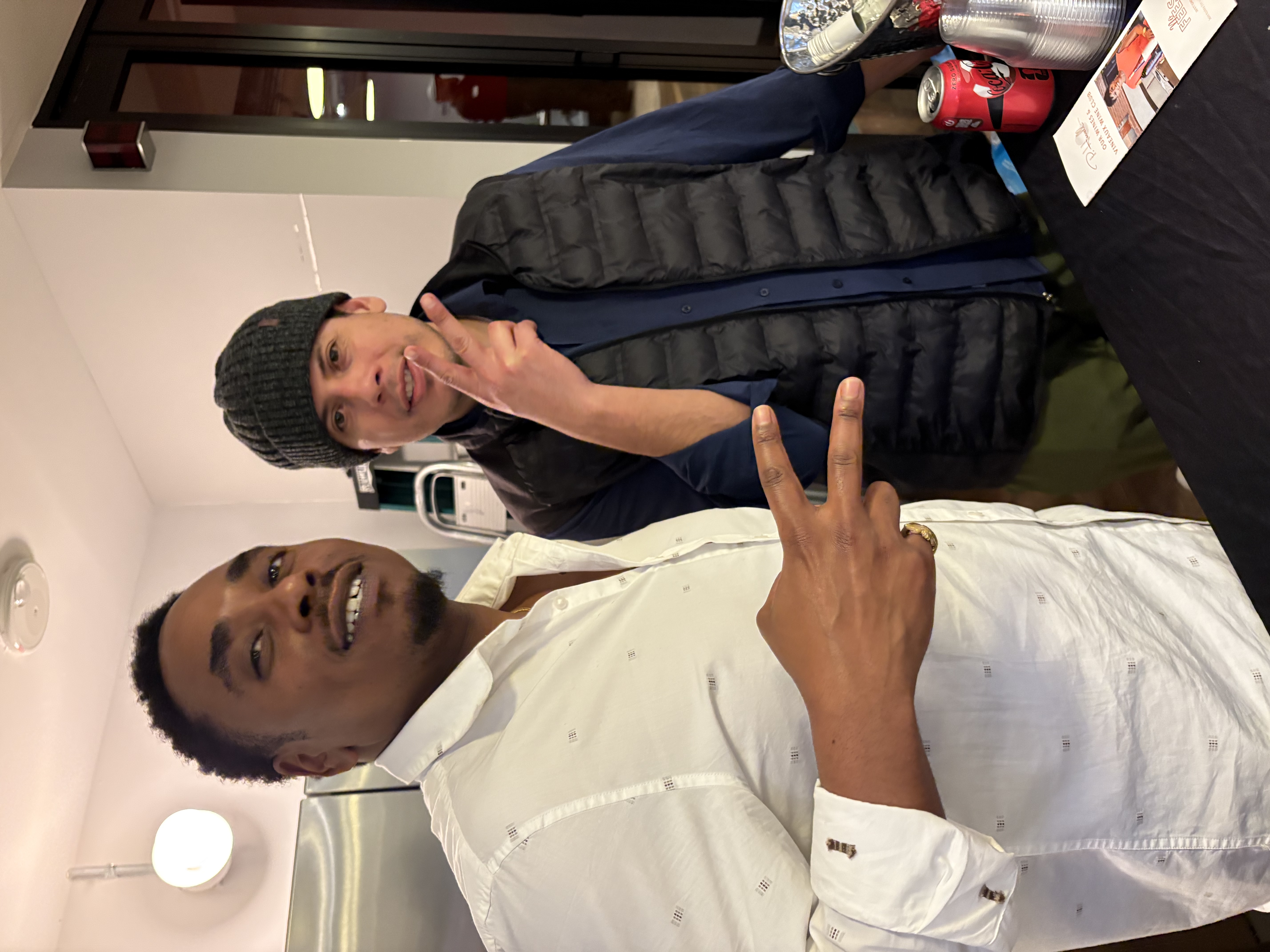 Two attendees in conversation at Physical Intelligence Night
